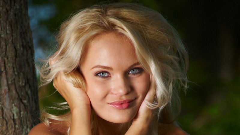 blonde woman in forest