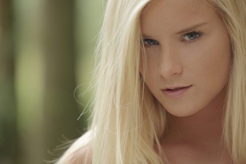 blonde woman in forest