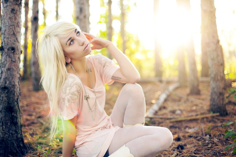 Blonde woman in forest
