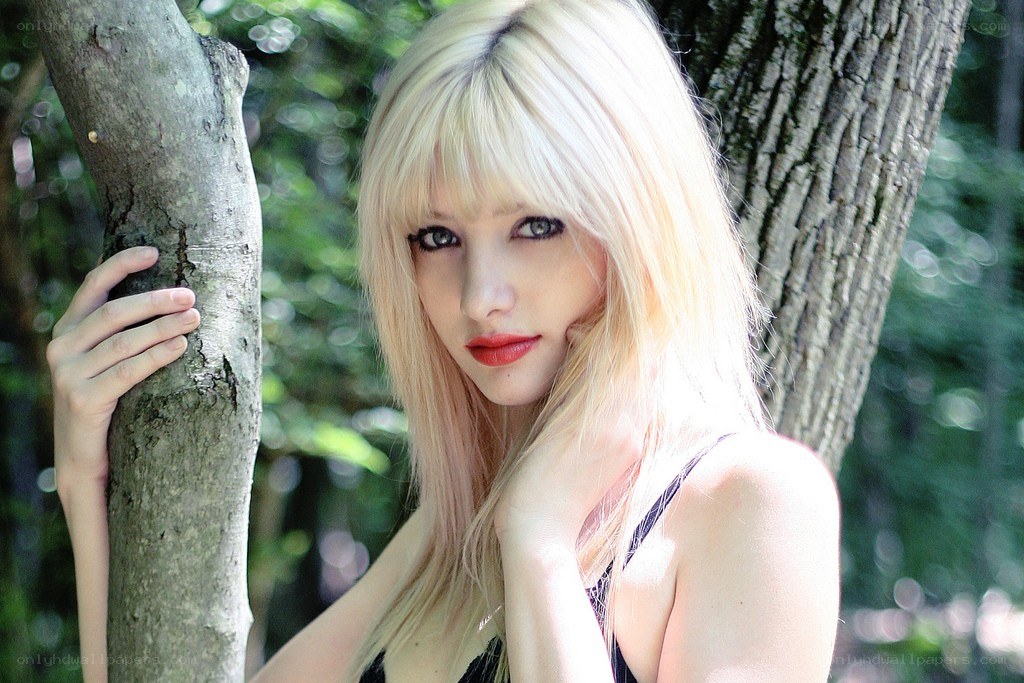 blonde woman in forest
