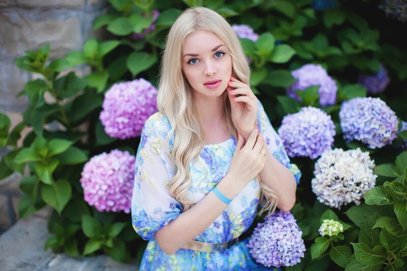 Blonde Woman in Garden — Blue