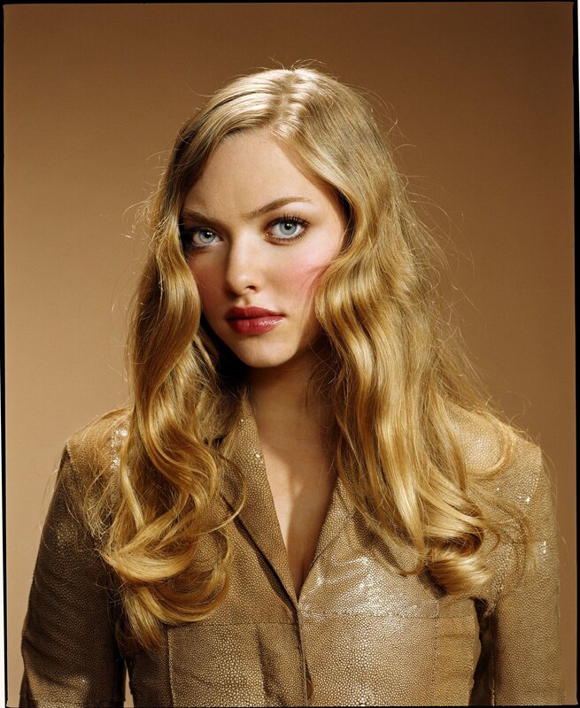 blonde woman in gold jacket