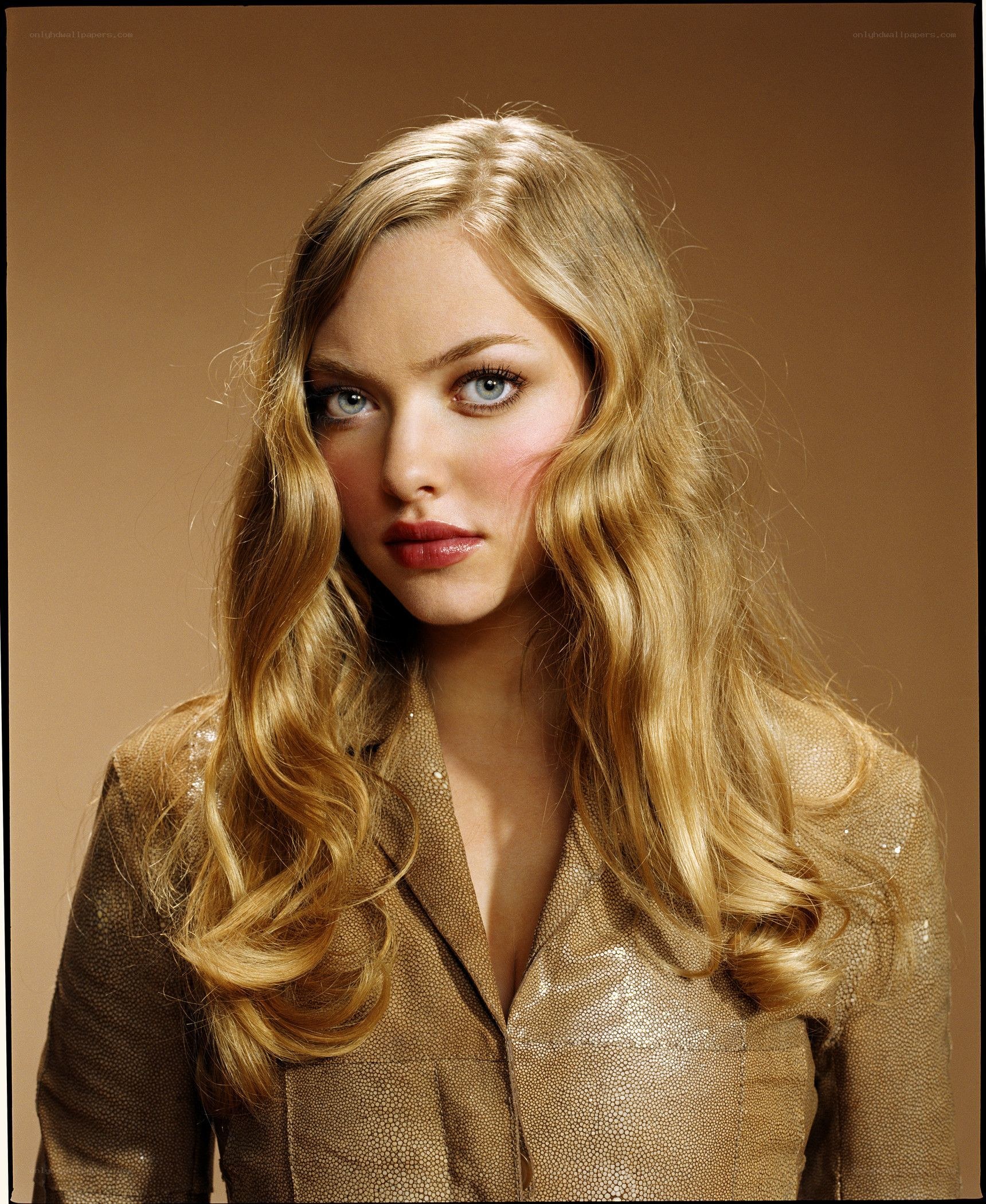 blonde woman in gold jacket