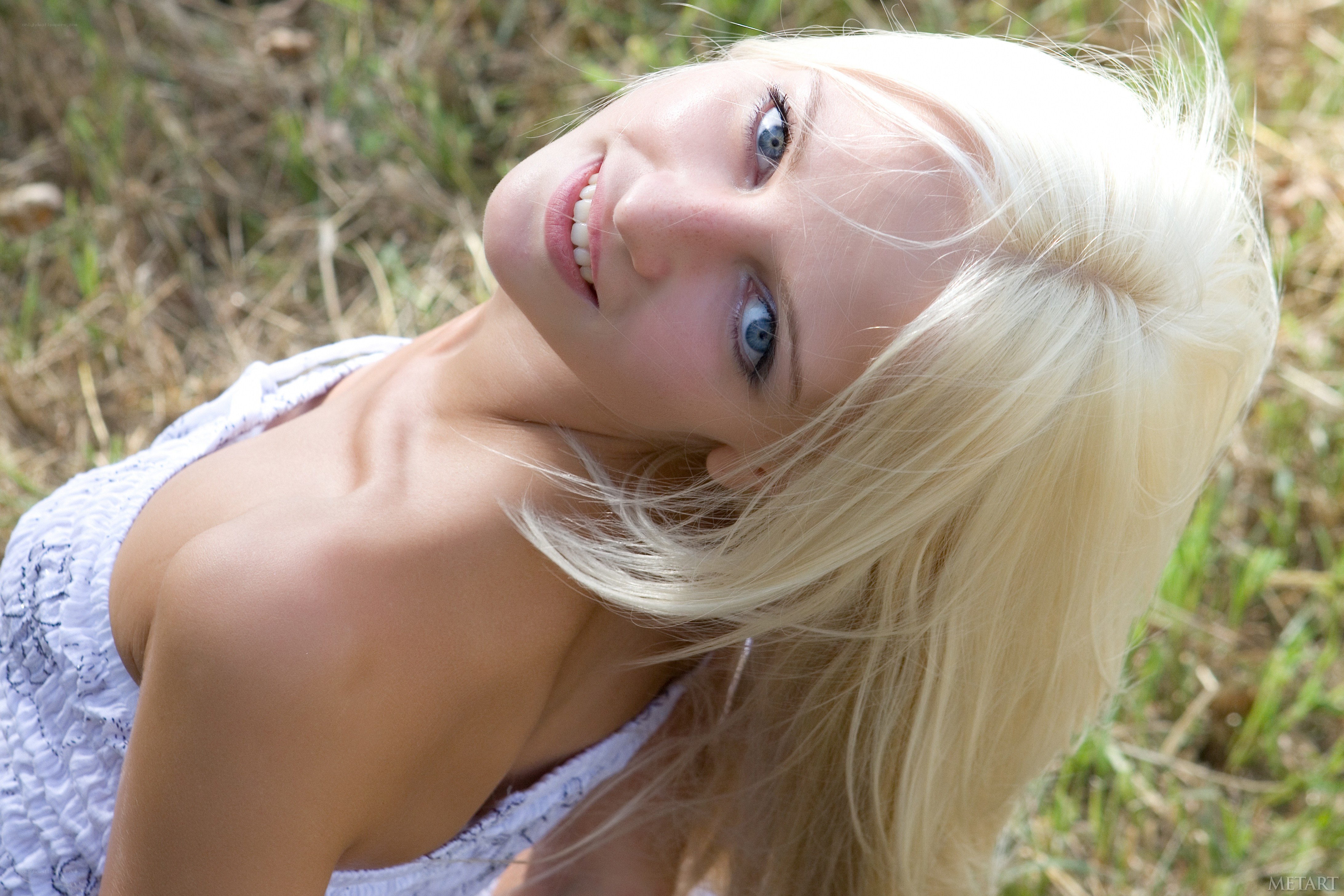 Blonde woman in grass