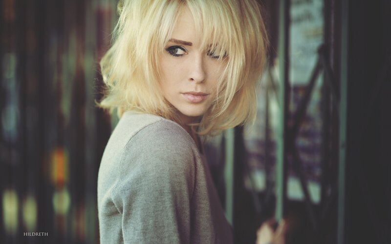 blonde woman in gray sweater