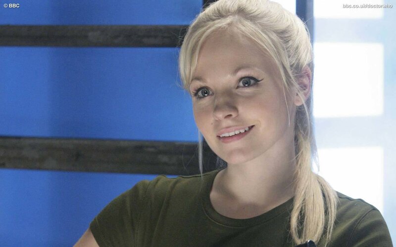Blonde Woman in Green Shirt — Blue