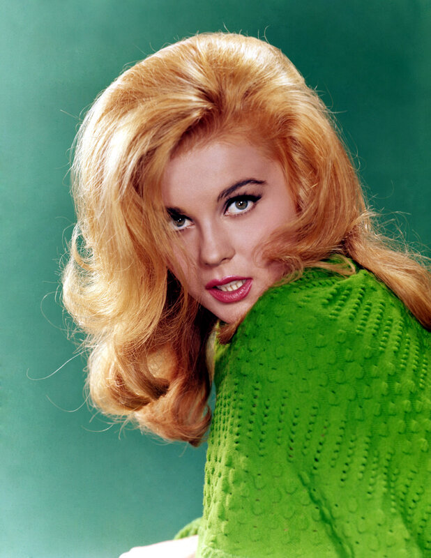 blonde woman in green sweater