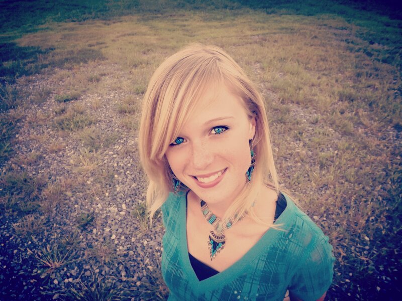 Blonde woman in green top