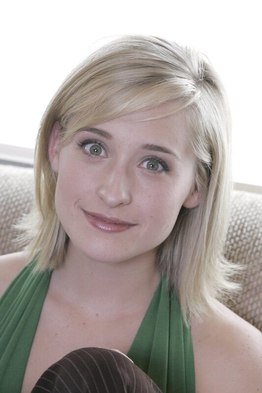 blonde woman in green top