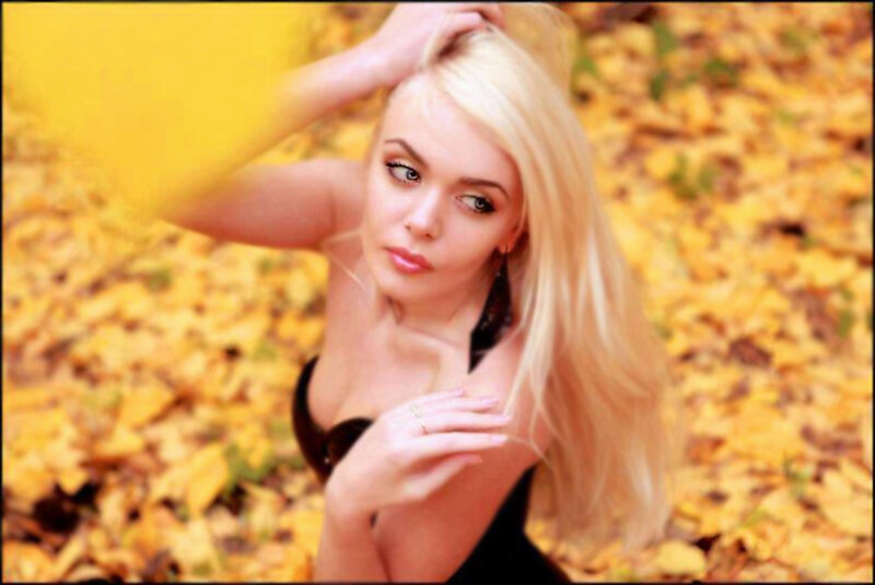 Blonde Woman in Leaves