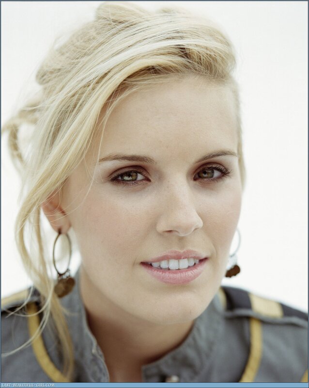 blonde woman in military-style jacket