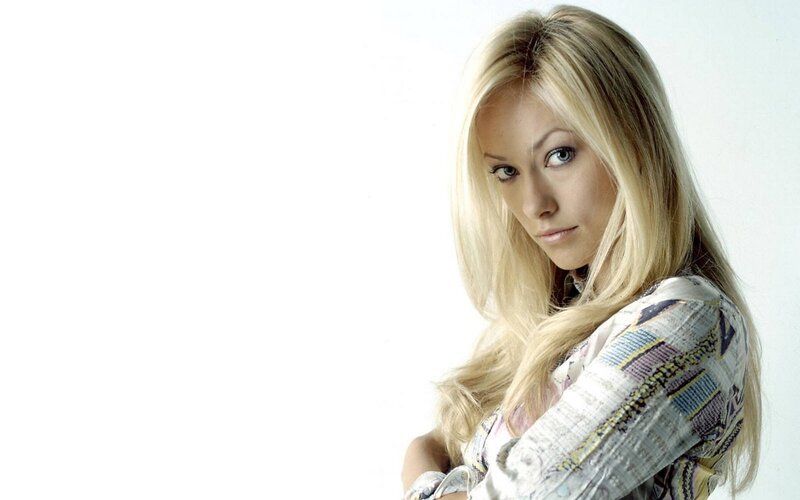 blonde woman in patterned shirt