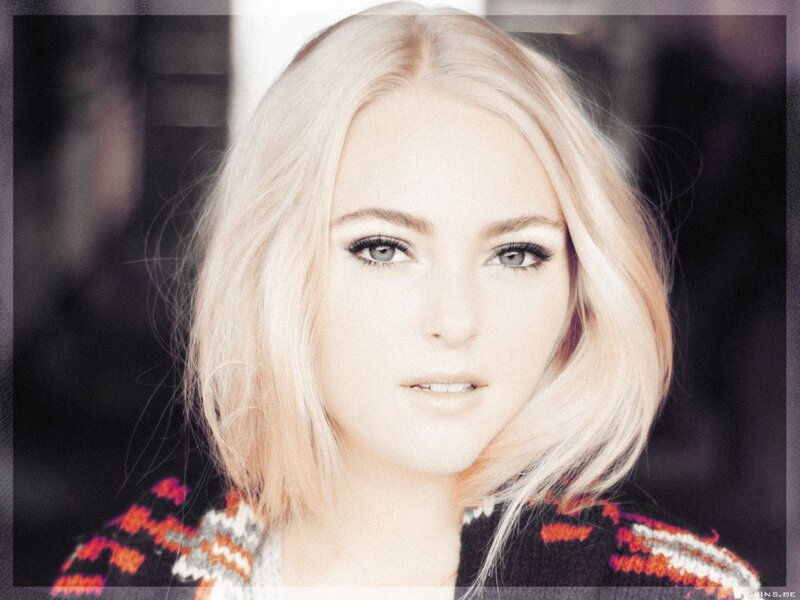 blonde woman in patterned sweater