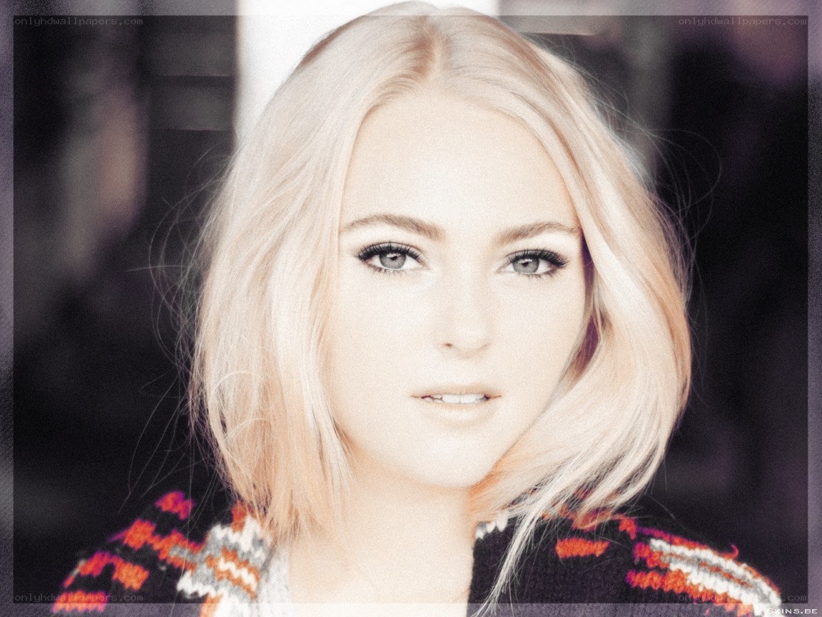 blonde woman in patterned sweater