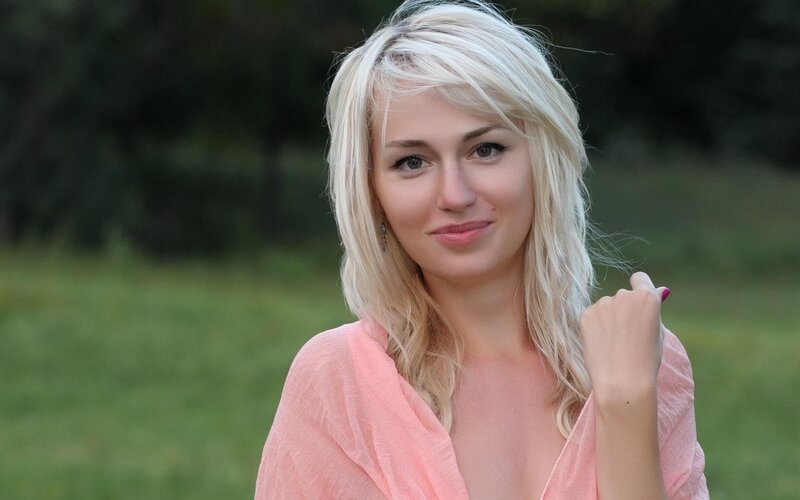 blonde woman in pink top