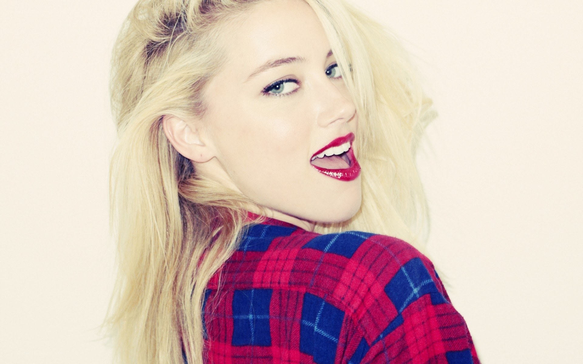 blonde woman in plaid shirt