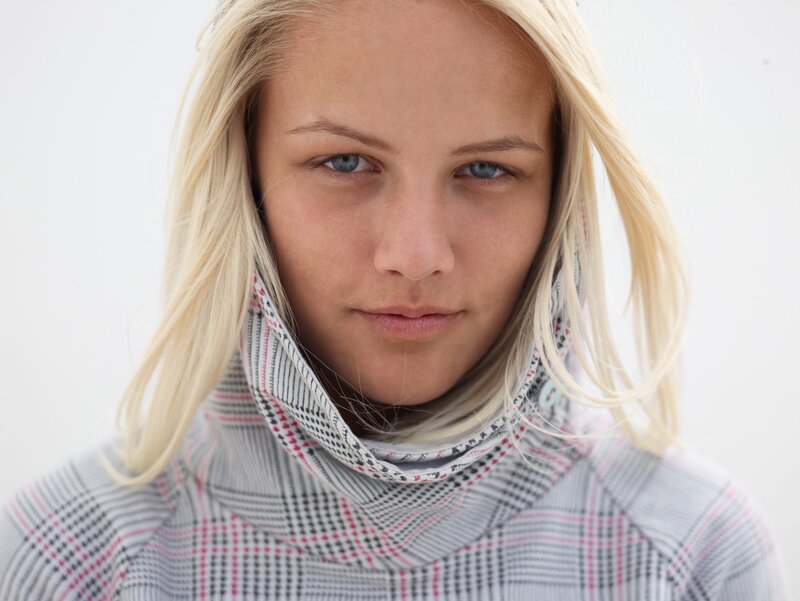 blonde woman in plaid turtleneck