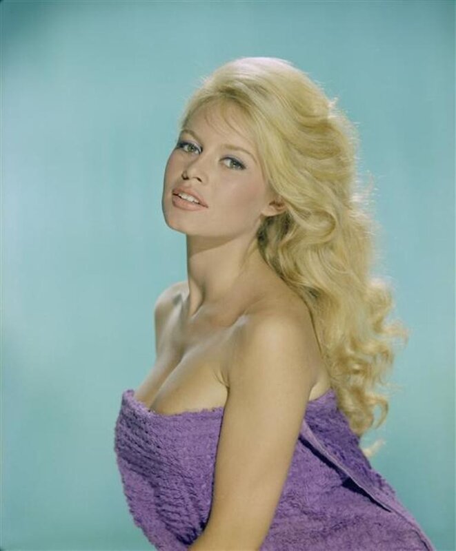 Blonde woman in purple dress