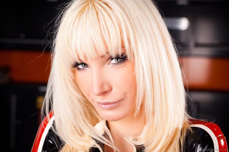 blonde woman in red and black outfit