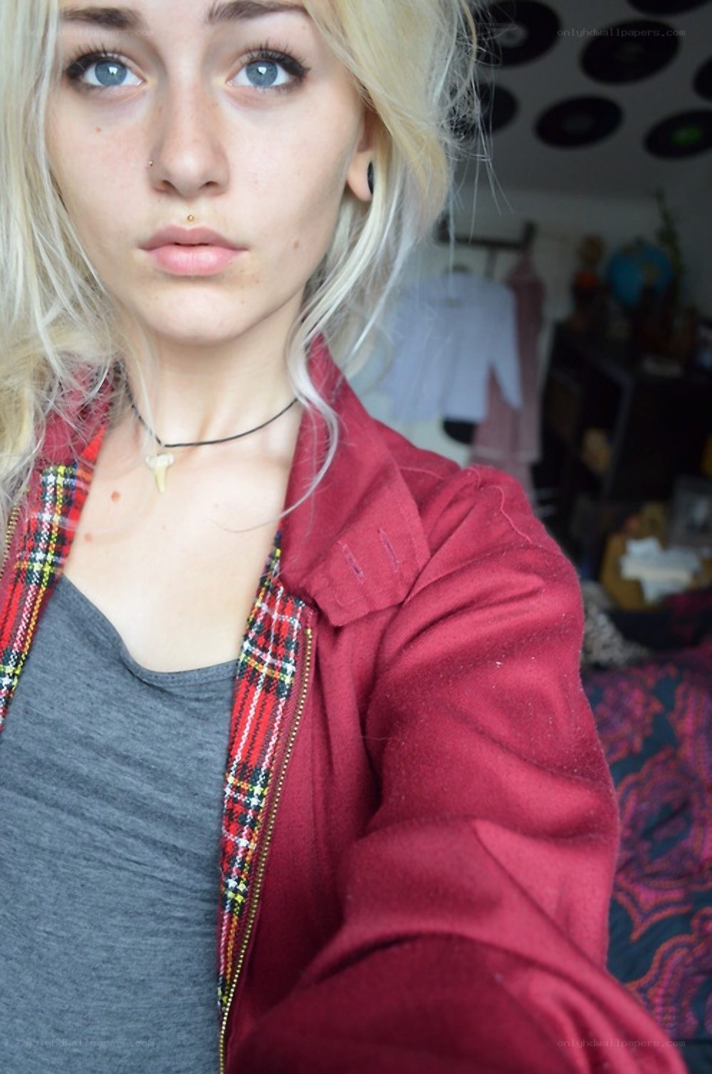 blonde woman in red jacket