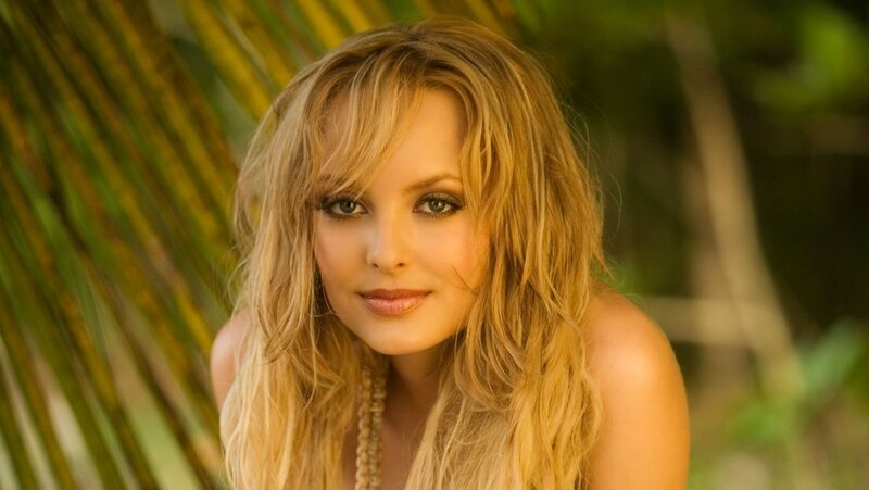 blonde woman in tropical setting