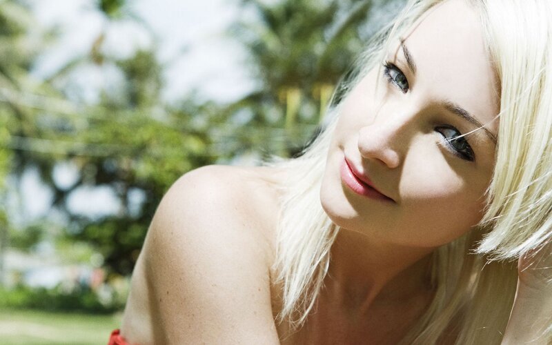 Blonde woman in tropical setting