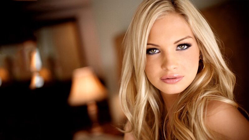 blonde woman in warm lighting