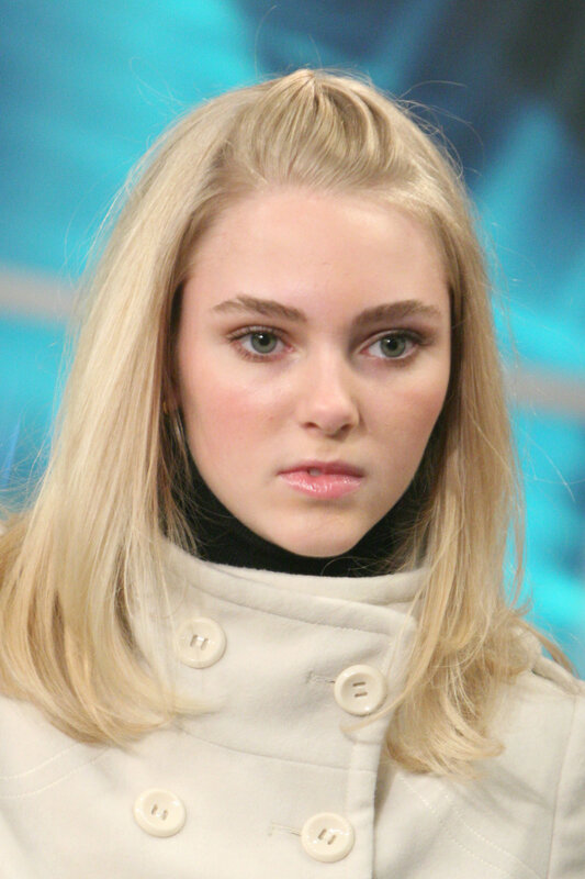 blonde woman in white coat