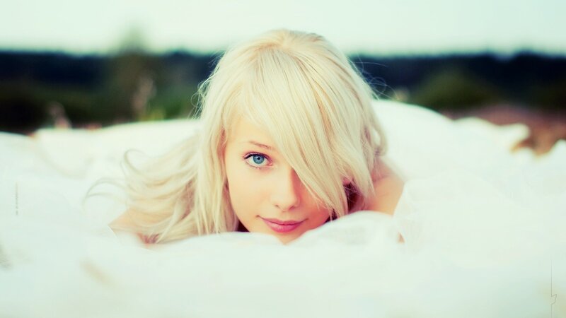 blonde woman in white fabric