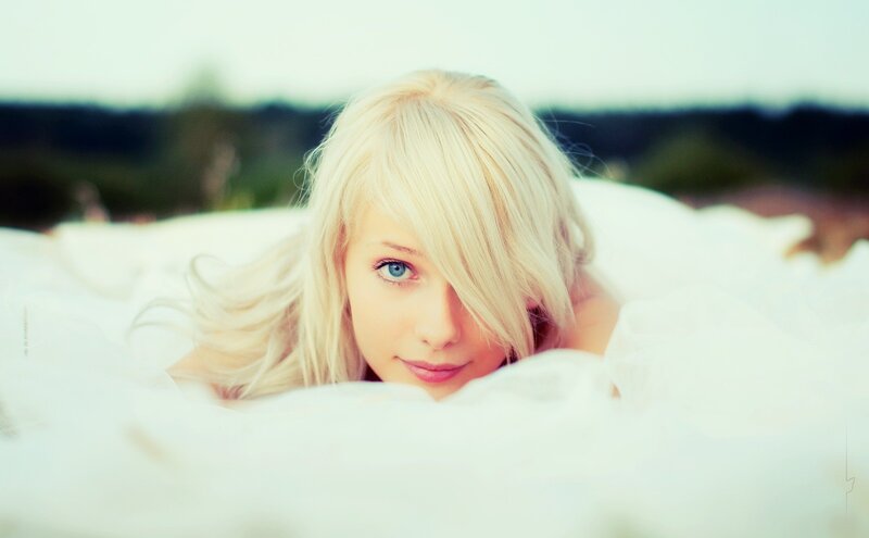 blonde woman in white fabric