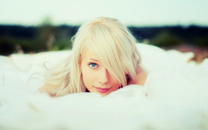 blonde woman in white fabric