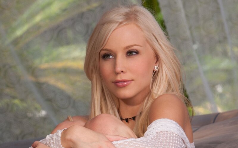 blonde woman in white top