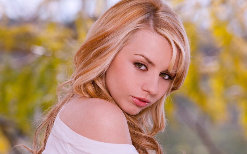 blonde woman in white top