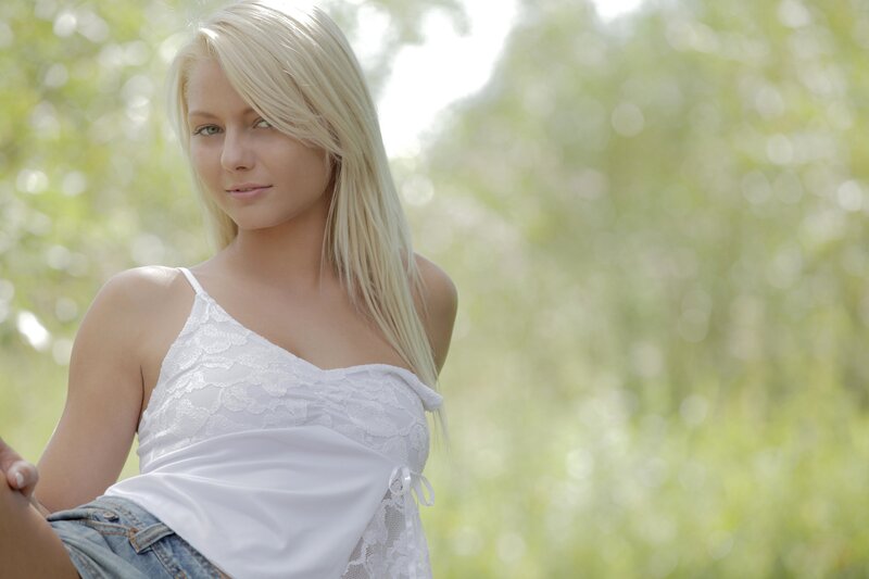 blonde woman in white top
