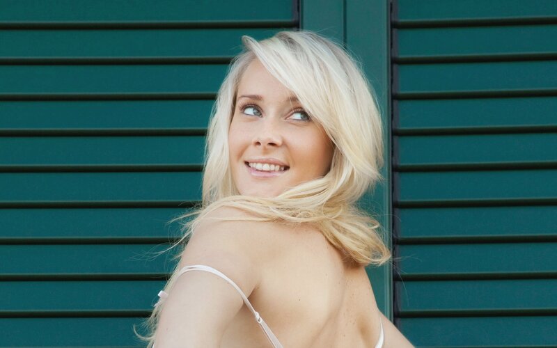 Blonde woman in white top