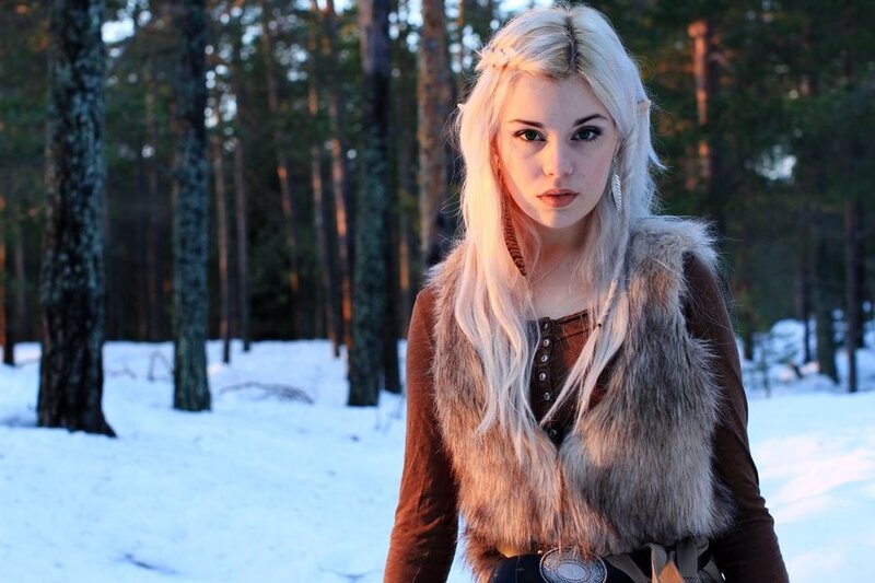 Blonde woman in winter forest