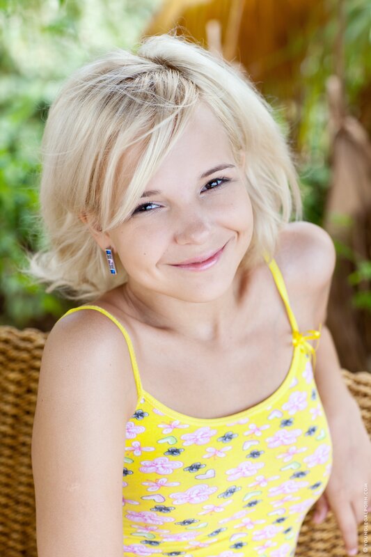 Blonde woman in yellow top