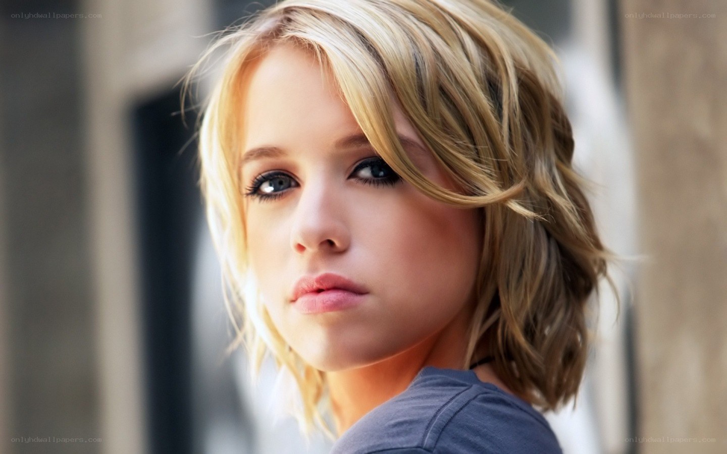 blonde woman looking at camera