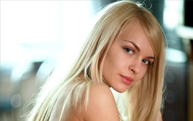 blonde woman looking at camera