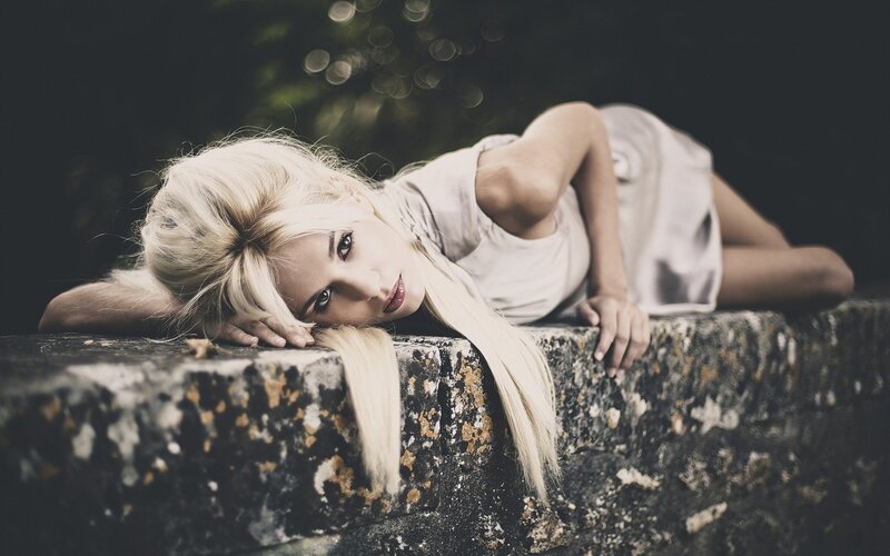 Blonde Woman Lying Down — White, Dramatic