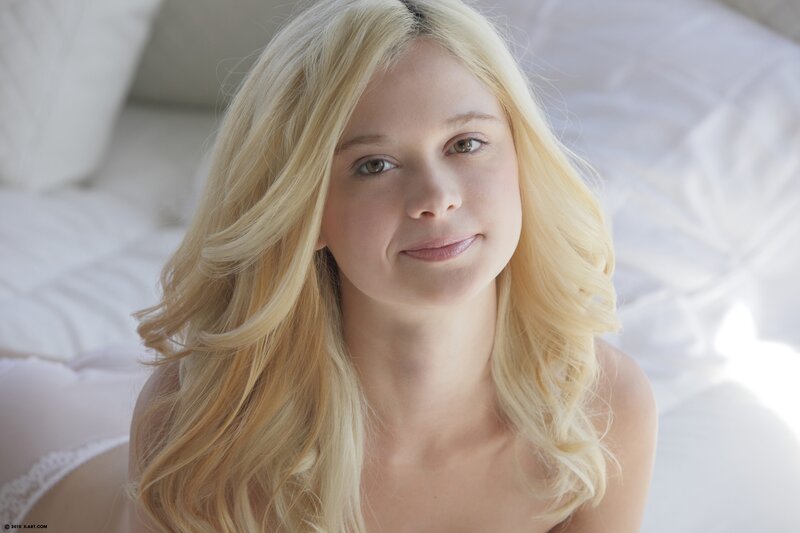 blonde woman on bed