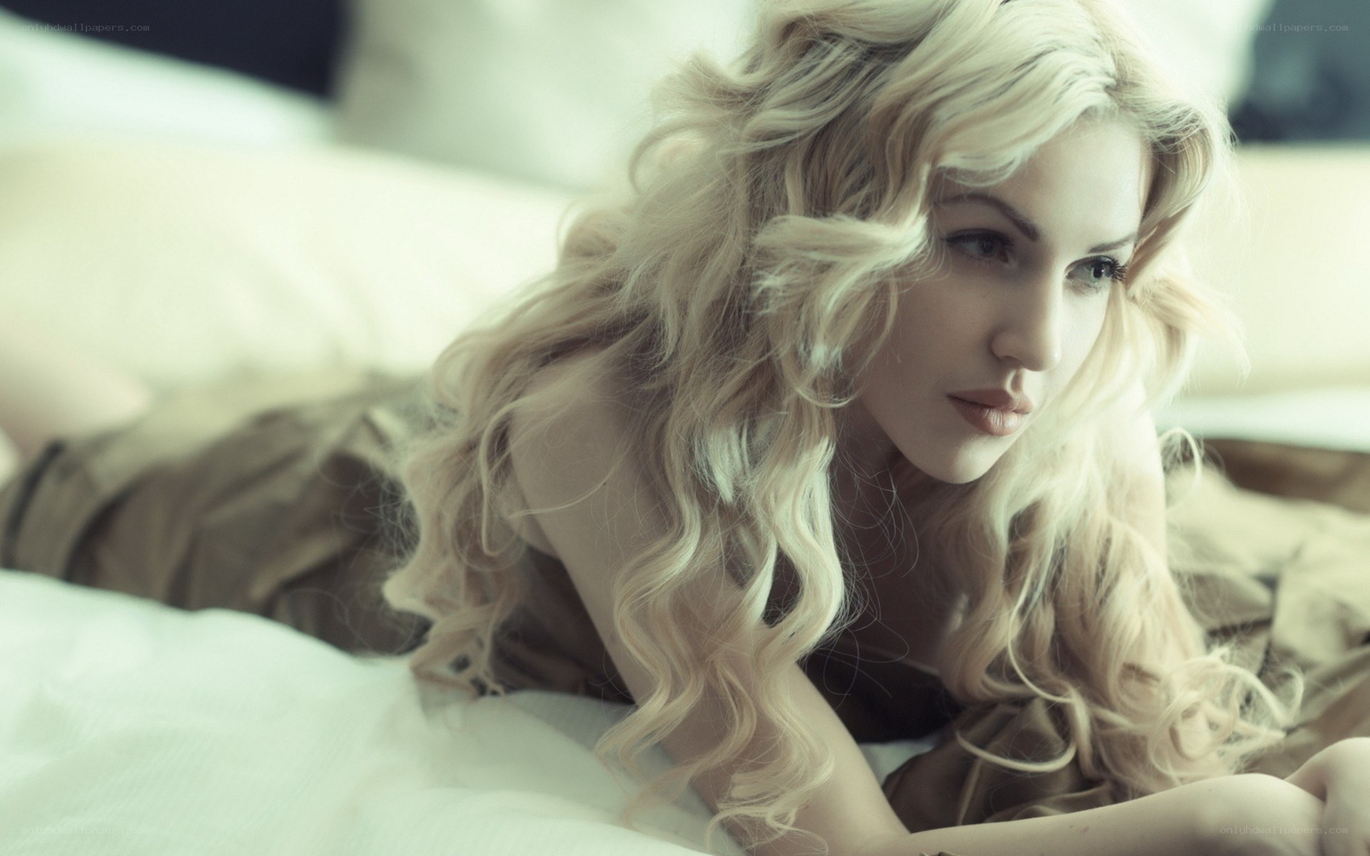 blonde woman on bed