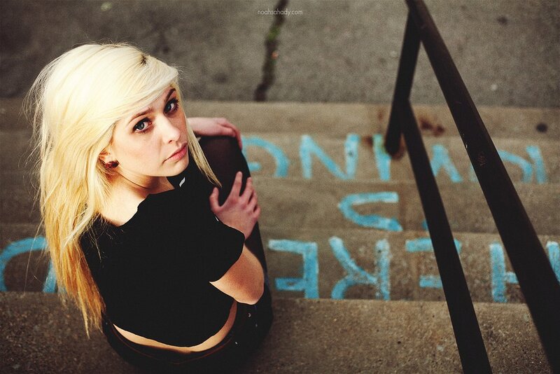 blonde woman on concrete stairs