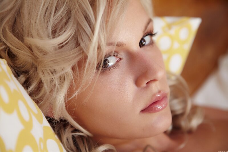blonde woman on pillow