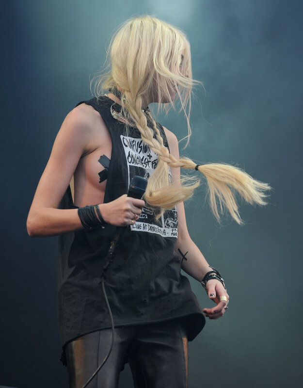 blonde woman performing on stage