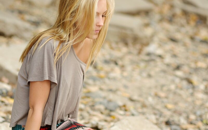 Blonde Woman Sitting — Gray, Contemplative