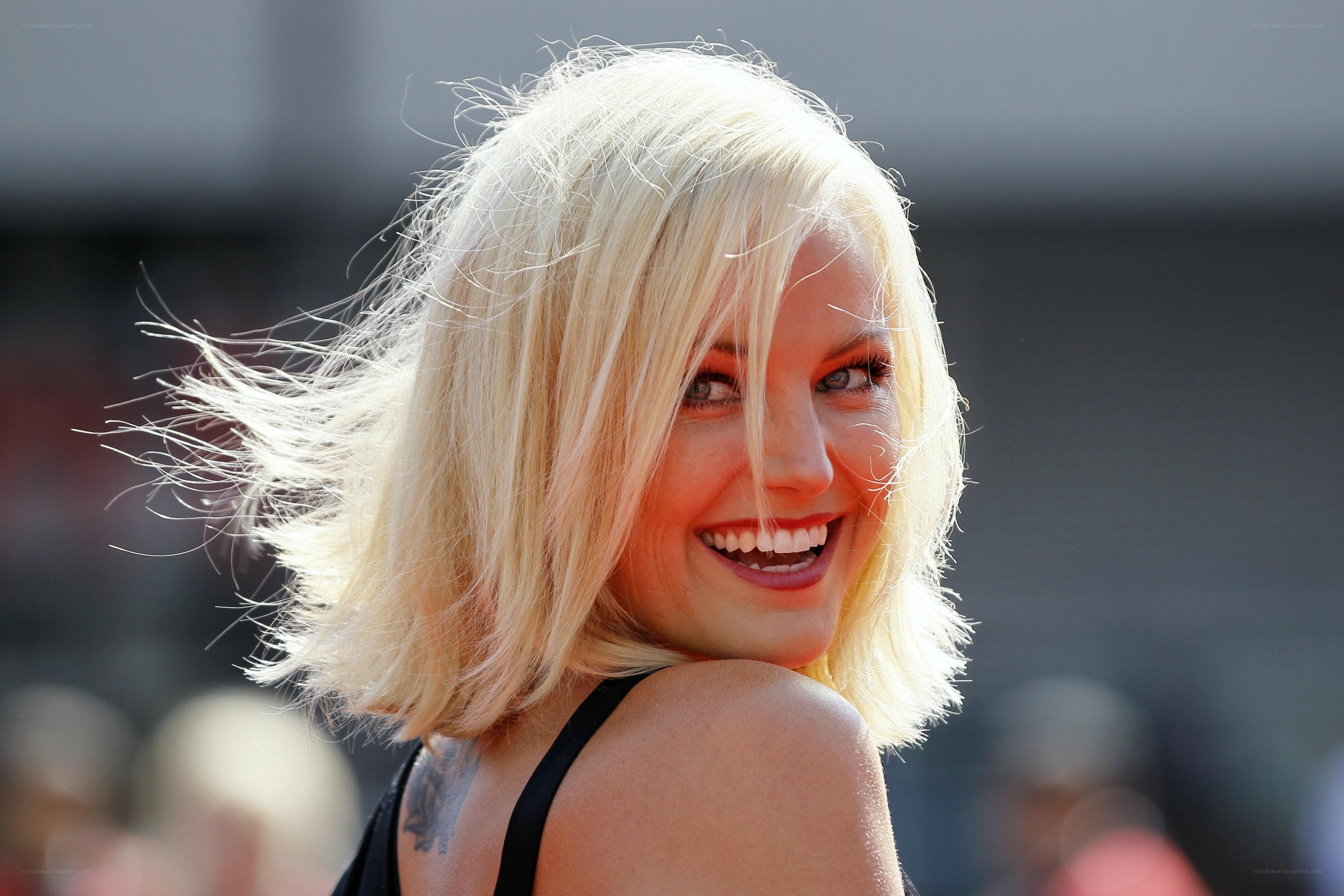 Blonde woman smiling at camera