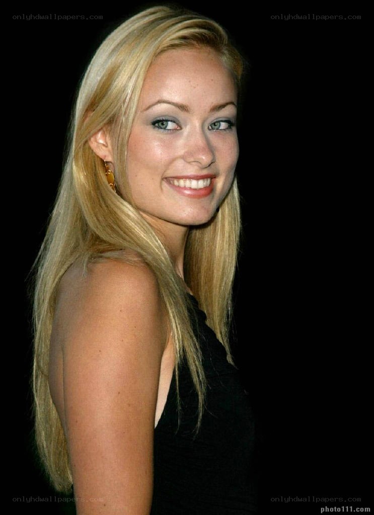 blonde woman smiling at camera