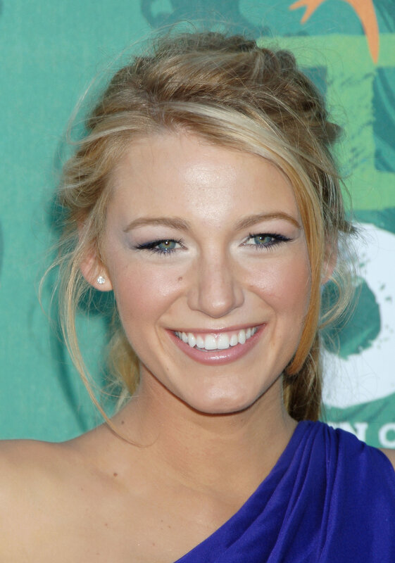 Blonde woman smiling at event