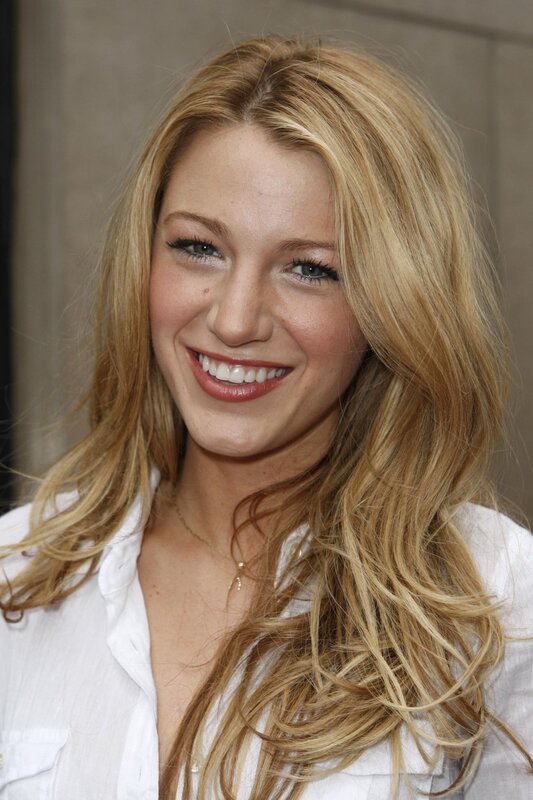 Blonde woman smiling at event